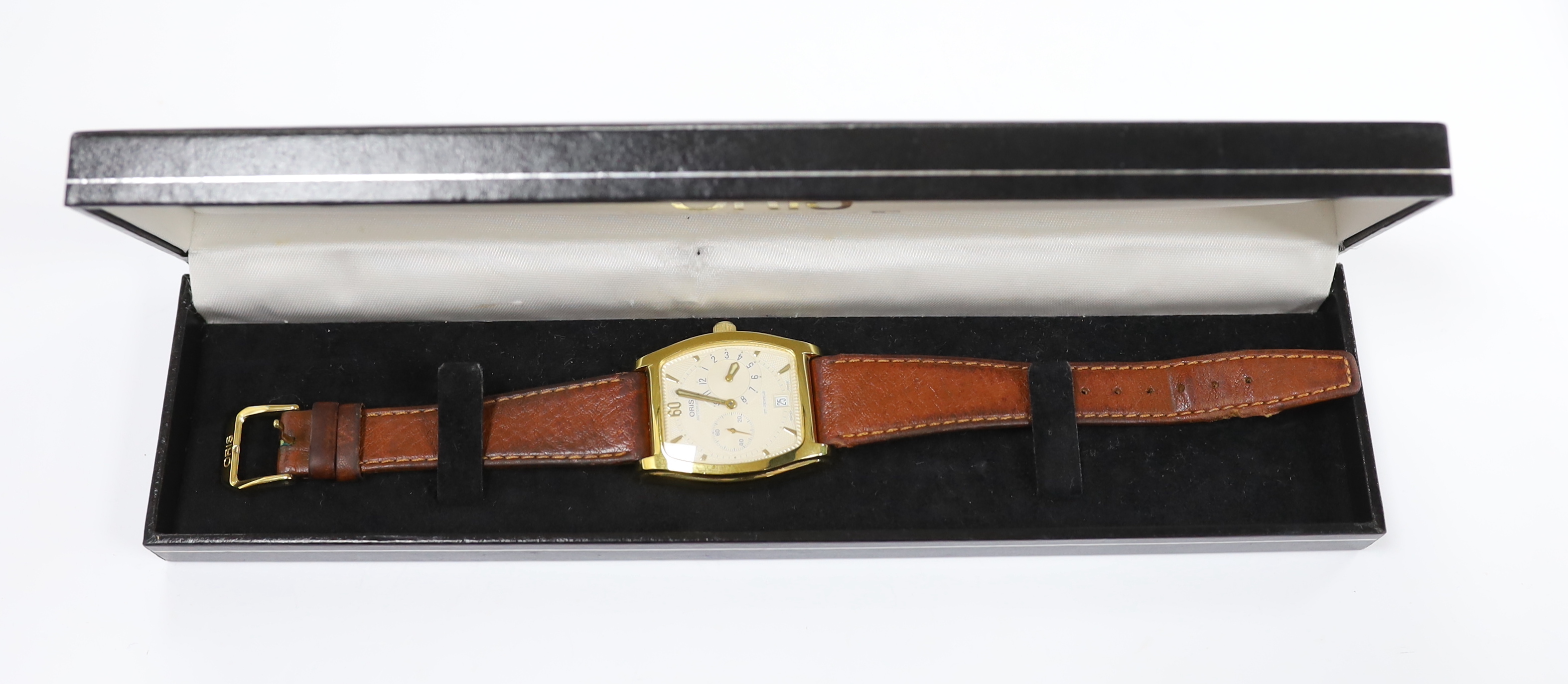A gentleman's steel and gold plated Oris Automatic wrist watch with tonneau case and two subsidiary dials, on a leather strap with Oris buckle, case diameter 33mm, with Oris box.